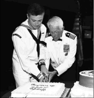 Above right: The oldest and youngest Sailors cut a cake in celebration of the Navy’s 244th birthday during the Navy Ball, Oct. 18.