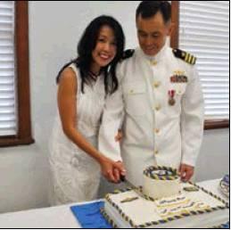 Cmdr. Kevin Norton and his wife Janet cut the ceremonial cake following Norton’s retirement from the U.S. Navy.